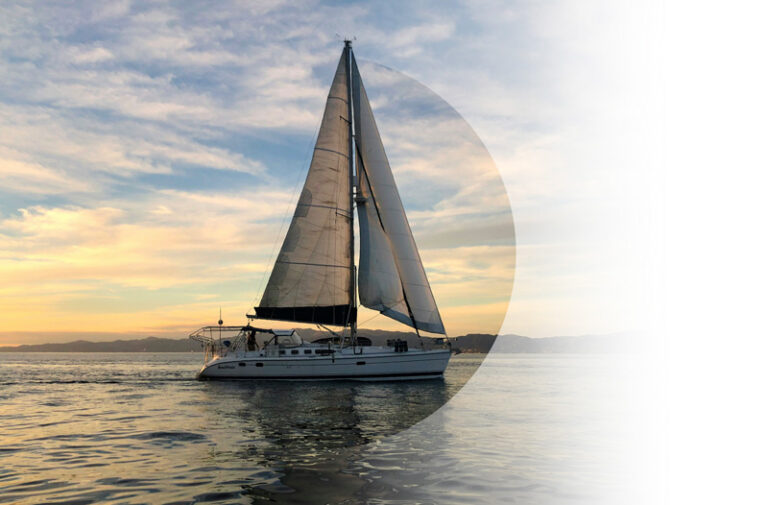 Vehicle Insurance example. Img: A sailboat at the end of a bluesky day, the golden hour tones on the horizon.