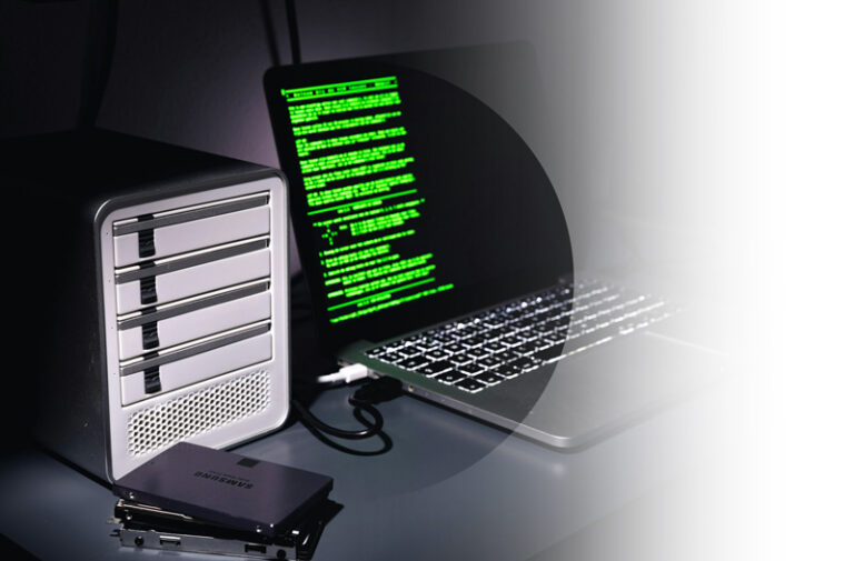 Commercial Insurance example. Img: Close up of a laptop with green coding across the screen. Matrix vibes.