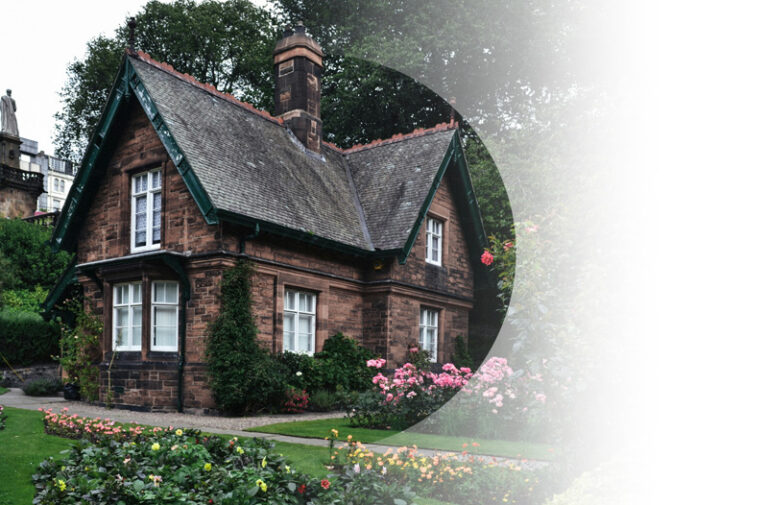 Home Insurance example. Img: A beautiful cottage with a garden and trees behind.
