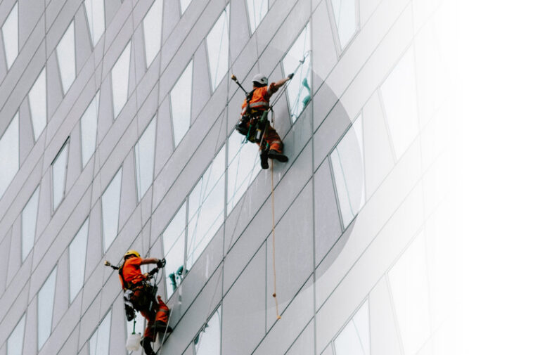 Liability Insurance example. Img: People cleaning windows of a high rise.